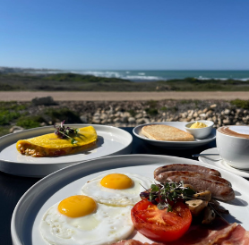 Full breakfast plate with eggs and bacon